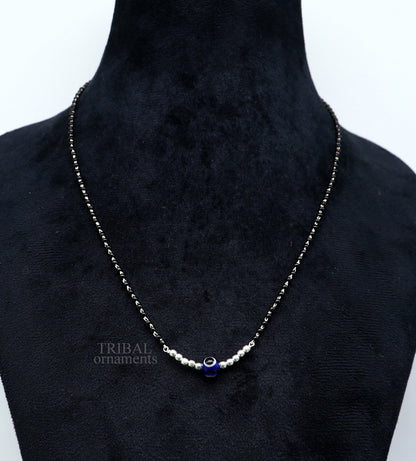925 silver beaded chain necklace with small evil eye pendant, traditional tribal design, black beads, and intricate silver craftsmanship