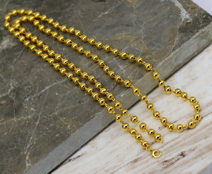 Sterling silver beaded necklace with gold polish, stylish unisex jewelry by TRIBAL ORNAMENTS, perfect for gifting.