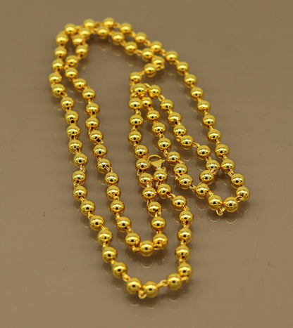 Sterling silver beaded necklace with gold polish, stylish unisex jewelry by Tribal Ornaments, handmade and perfect for gifting.