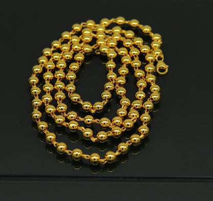 Sterling silver and gold polished beaded necklace by Tribal Ornaments, stylish unisex jewelry with handcrafted design.