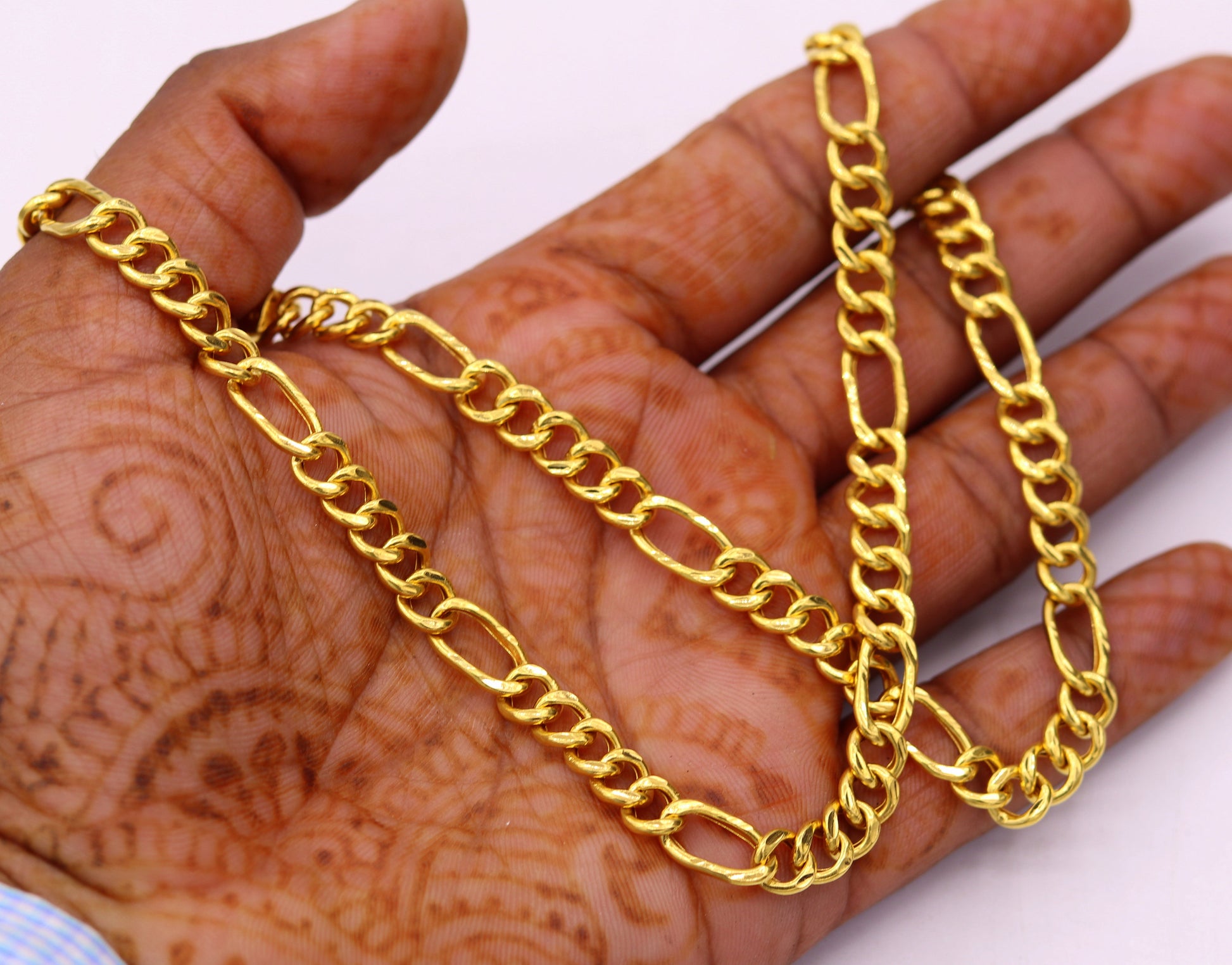 Handmade 22K yellow gold Figaro link chain necklace, 6mm wide, unisex design with intricate craftsmanship and classic jewelry style.