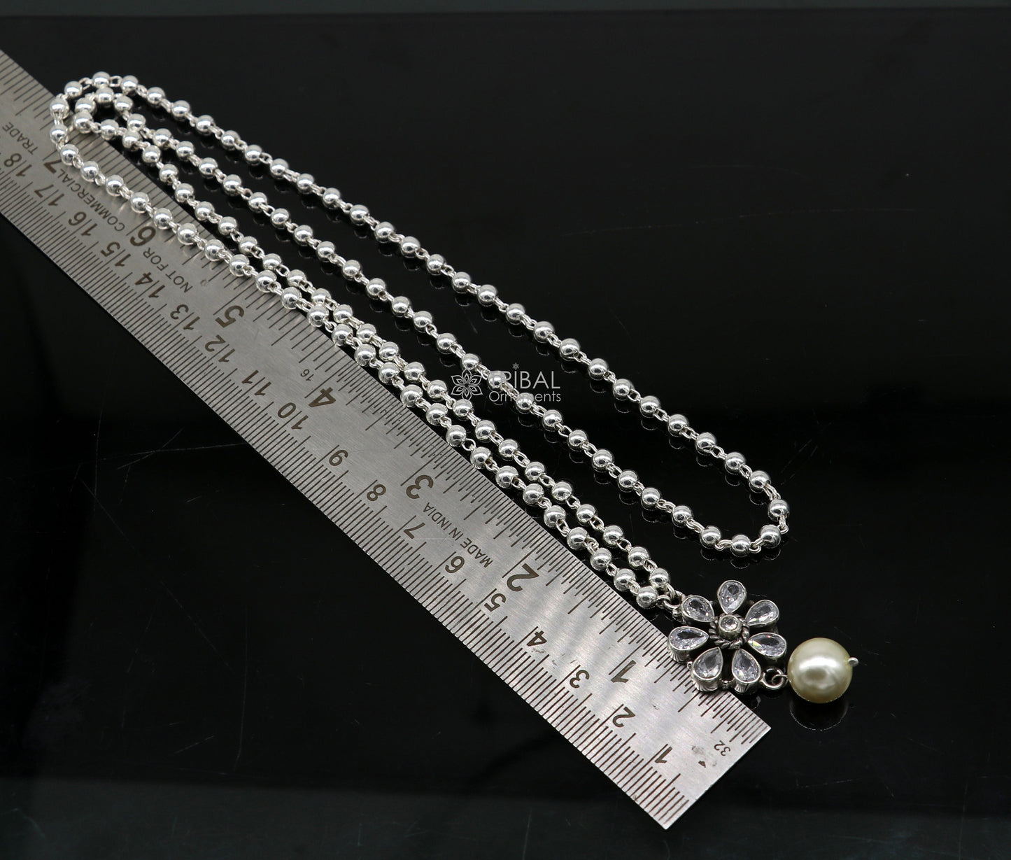 Sterling silver bead chain necklace with flower pendant and hanging pearl jewelry set, traditional tribal ornament style.