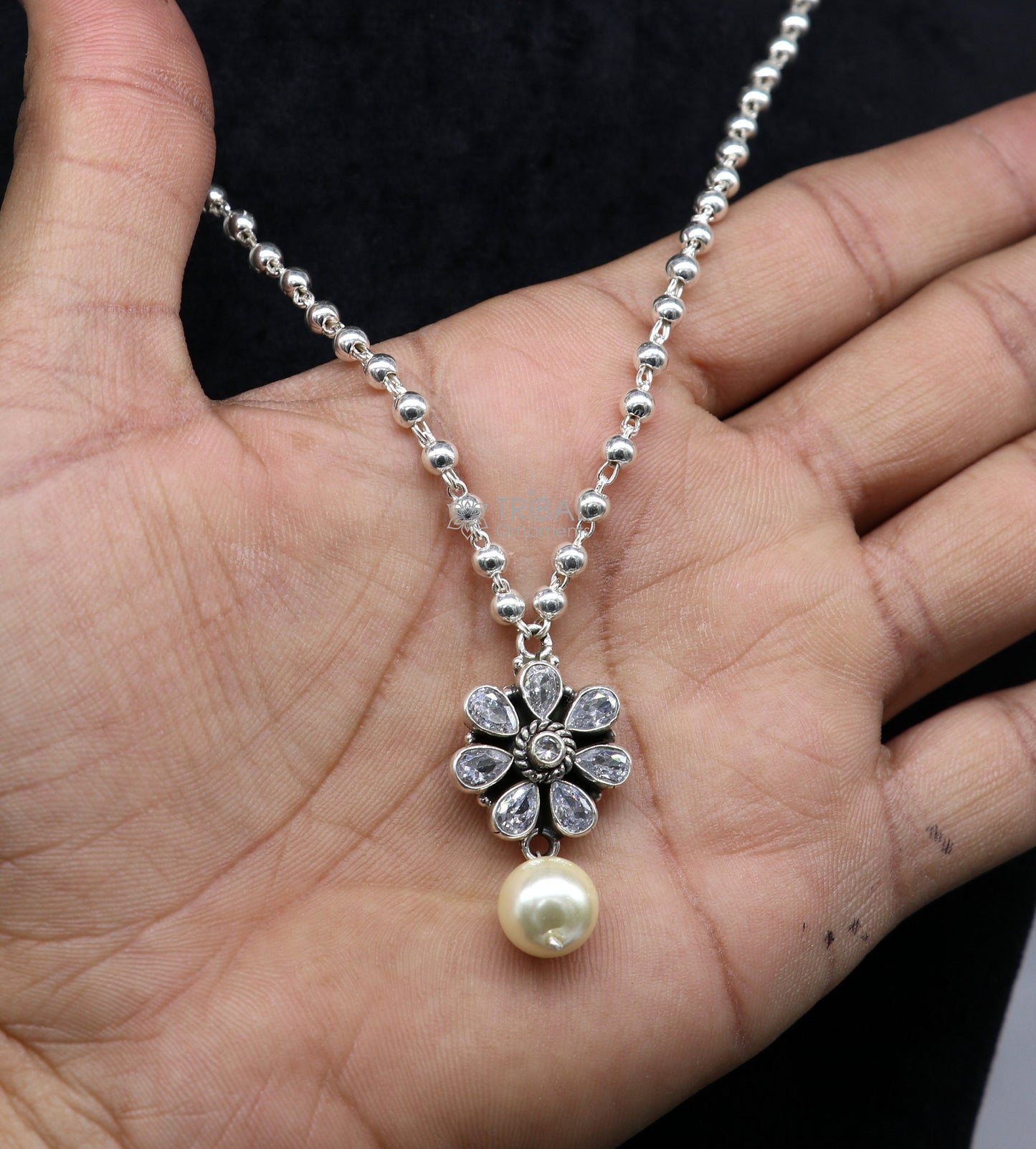 Sterling silver beaded ball chain necklace with floral pendant and hanging pearl, part of TRIBAL ORNAMENTS jewelry set.