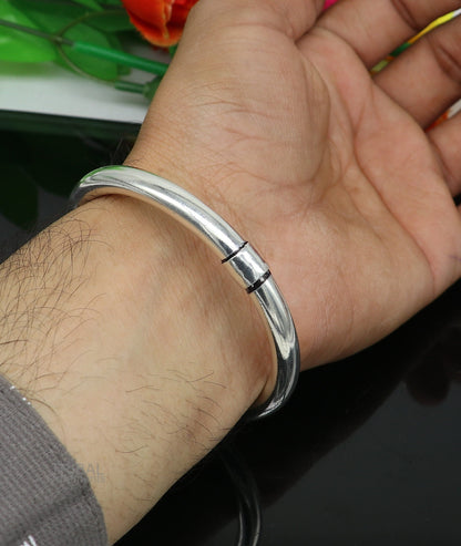Sterling silver bangle bracelet by TRIBAL ORNAMENTS, shiny and plain, stylish men's or girls' kada for personalized gifting.