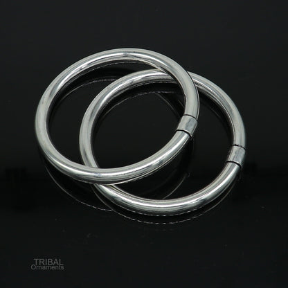 Sterling silver bangle bracelet by Tribal Ornaments, shiny and bright, stylish kada for men or girls, perfect for personalized gifting.