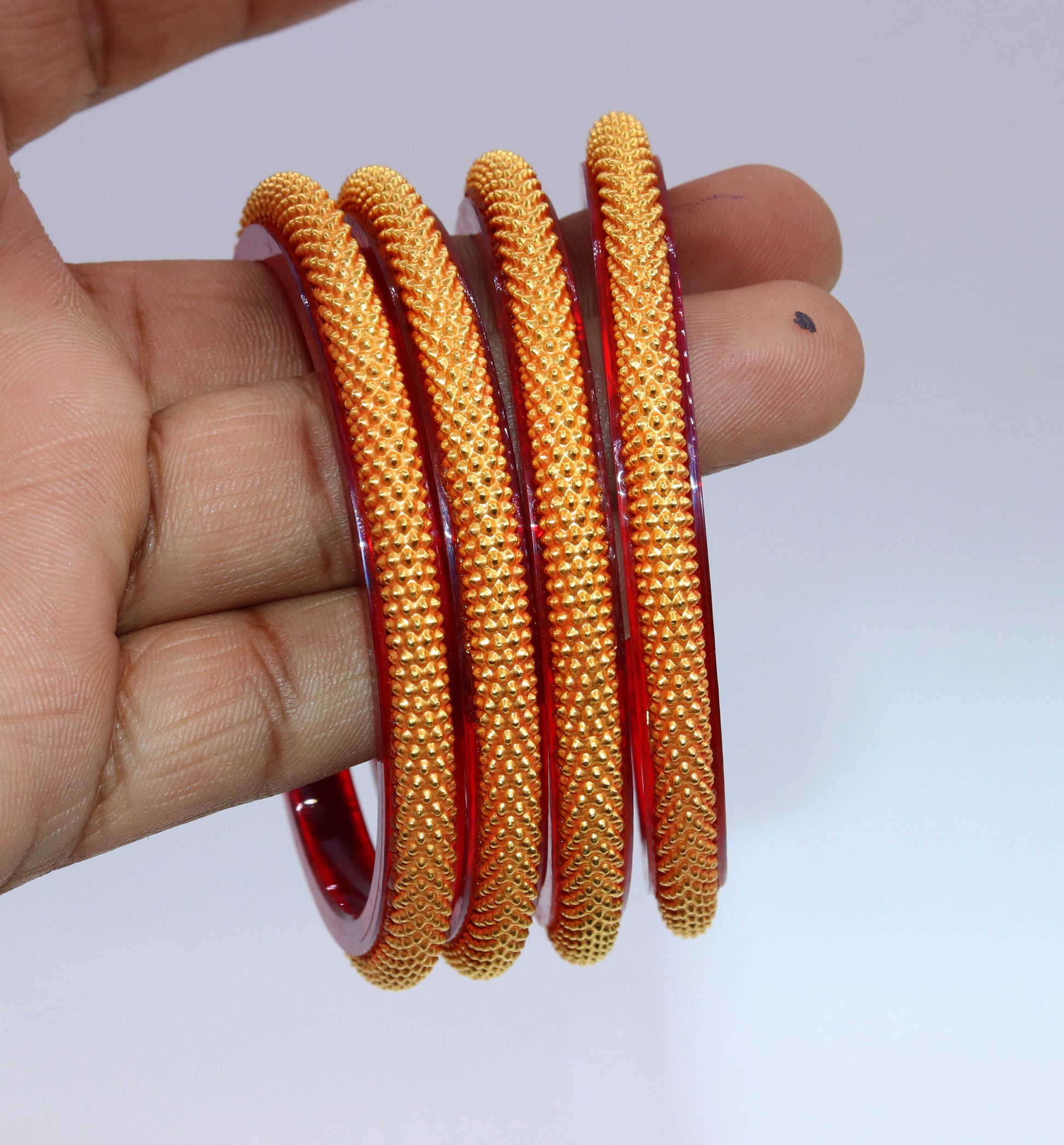 Vintage 22KT yellow gold tribal bangle bracelet with intricate handmade design, traditional bridal jewelry from India.