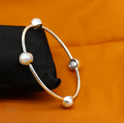 Sterling silver tribal bangle with freshwater pearl accents, stylish handmade jewelry from TRIBAL ORNAMENTS.