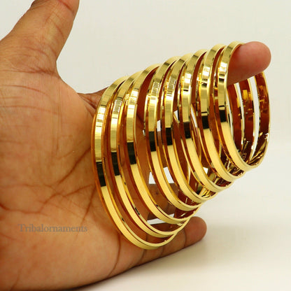 Sterling silver Punjabi Sikkh Kada by TRIBAL ORNAMENTS, handmade solid silver Rajputi gold-polished bangle with intricate design.