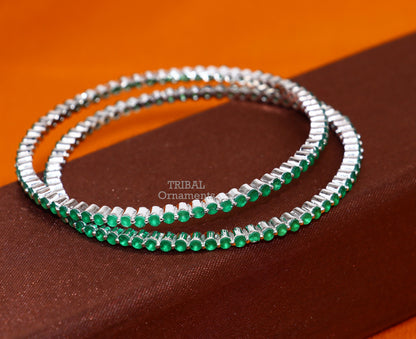 Sterling silver bangle bracelet with stunning green cubic zirconia, handmade jewelry by TRIBAL ORNAMENTS for women.