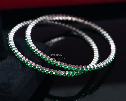 Sterling silver bangle bracelet with vibrant green cubic zircon, handmade jewelry by TRIBAL ORNAMENTS, perfect for women.