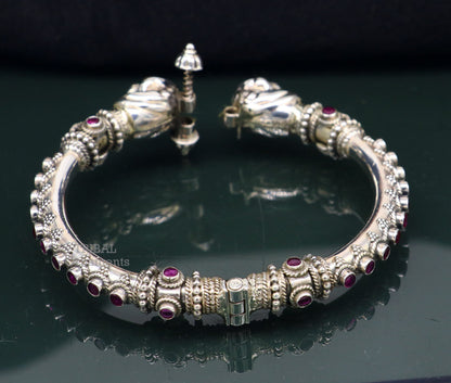 Sterling silver tribal bangle bracelet with peacock design and cubic zircon stones, handmade ethnic jewelry by TRIBAL ORNAMENTS.