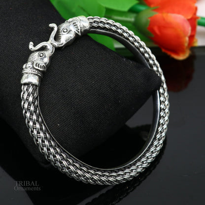 Sterling silver vintage elephant face bangle bracelet by TRIBAL ORNAMENTS, handcrafted stylish jewelry with intricate tribal design.