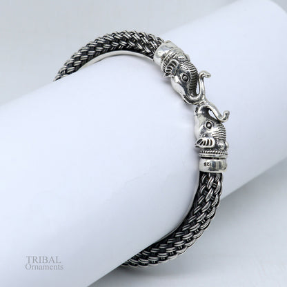 Sterling silver vintage elephant face bangle bracelet from TRIBAL ORNAMENTS, handcrafted Indian jewelry with intricate elephant design.