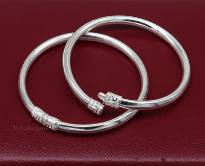 Sterling silver half-round bangle bracelet with intricate tribal design, handmade jewelry by Tribal Ornaments.