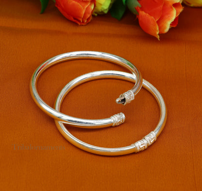 Sterling silver half-round tribal bangle bracelet with intricate handmade design, perfect as a gift or tribal jewelry accessory.