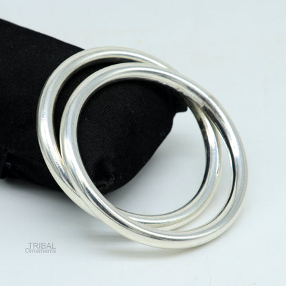 925 sterling silver shiny bangle bracelet from TRIBAL ORNAMENTS, featuring a smooth, bright finish, ideal for men or women.