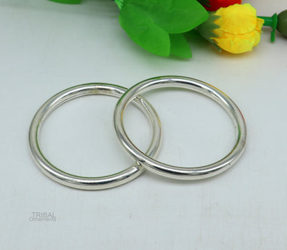 Sterling silver bangle bracelet from Tribal Ornaments, shiny and bright, stylish unisex jewelry for men and women.