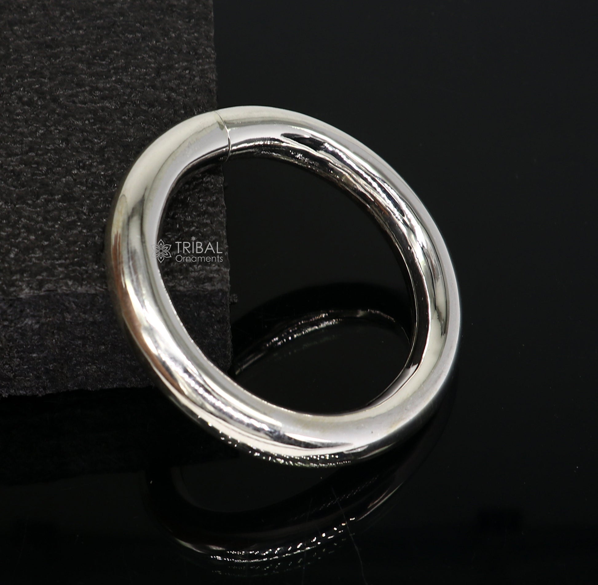 Sterling silver bangle bracelet by TRIBAL ORNAMENTS, plain shiny unisex jewelry, handmade and personalized, 12mm width.