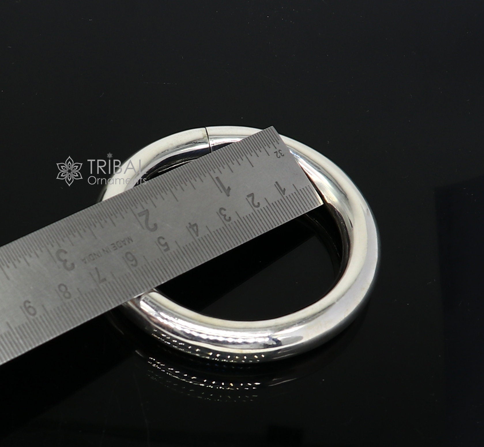 925 sterling silver bangle bracelet by TRIBAL ORNAMENTS featuring a plain shine finish, unisex design, perfect for personalized jewelry.