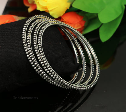 Sterling silver bangle bracelet with waved silver balls design, stylish designer jewelry by TRIBAL ORNAMENTS.