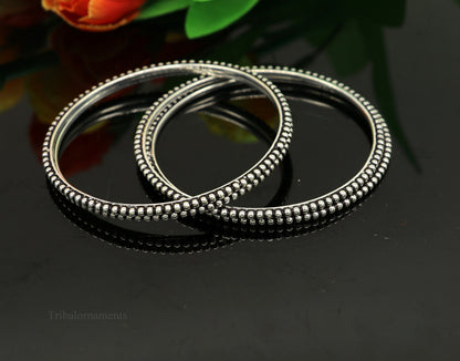 Sterling silver bangle bracelet with waved silver balls design, stylish and customized, ideal as gift jewelry by TRIBAL ORNAMENTS.