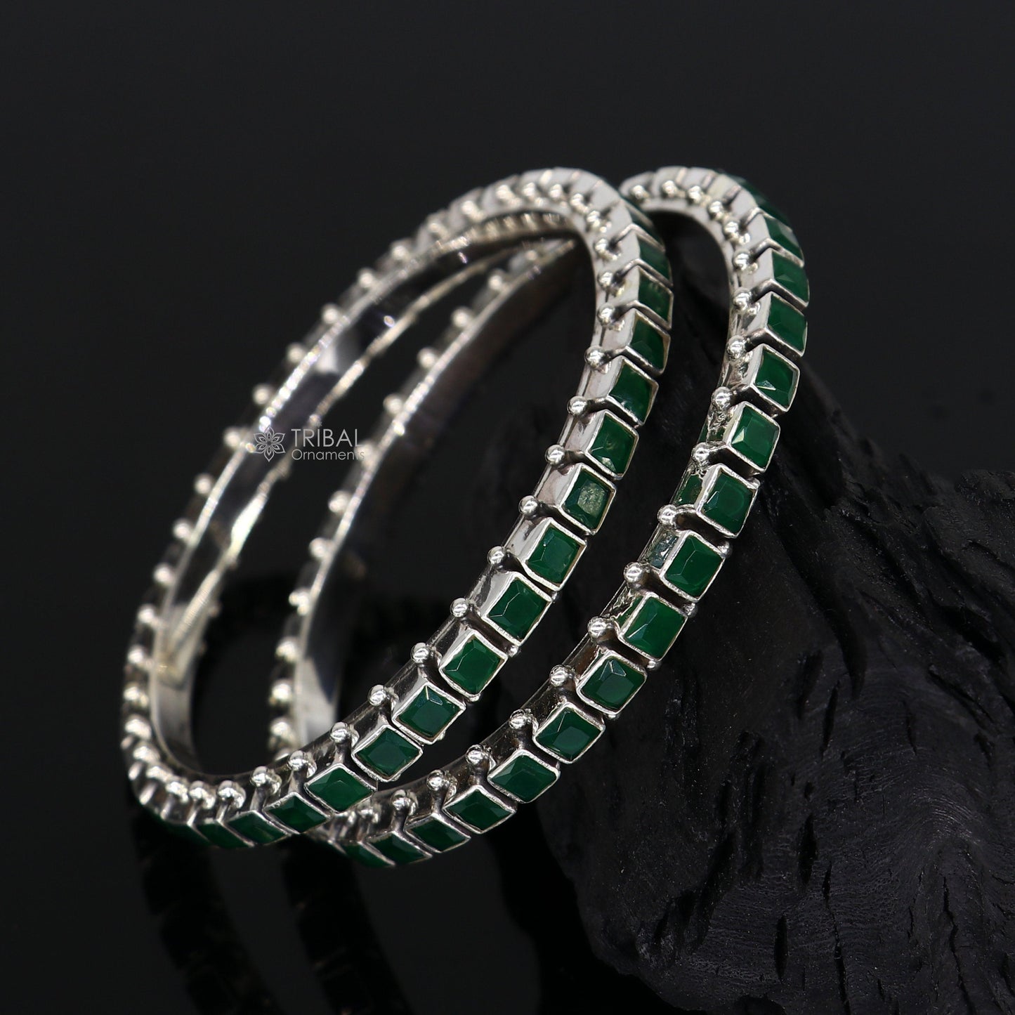 Sterling silver bangle bracelet with green square-shaped stone, tribal jewelry design, ideal for anniversary gifting.