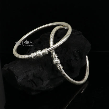 Sterling silver bangle bracelet with intricate tribal design, handcrafted by TRIBAL ORNAMENTS, perfect as customized jewelry gift