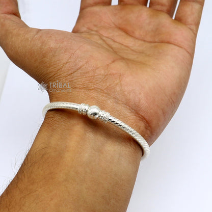 Sterling silver bangle bracelet with customized tribal design, handcrafted tribal ornaments jewelry with intricate patterns.