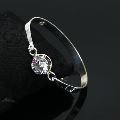 Elegant 925 sterling silver bangle bracelet with cubic zirconia stones, featuring a sleek design ideal for gifting or stylish wear.