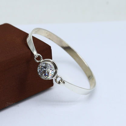 Elegant 925 sterling silver cubic zirconia bangle bracelet with intricate design, perfect for gifting or stylish wear.
