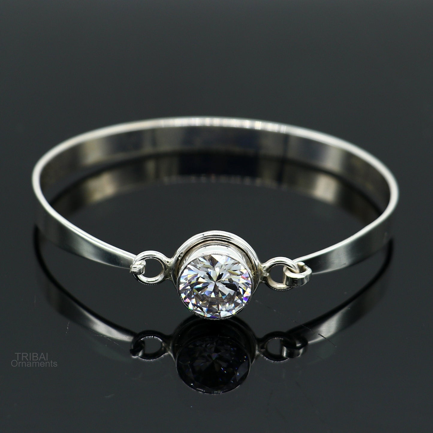 Elegant 925 sterling silver bangle bracelet with cubic zirconia stones, featuring intricate tribal-inspired design, perfect for gifting.