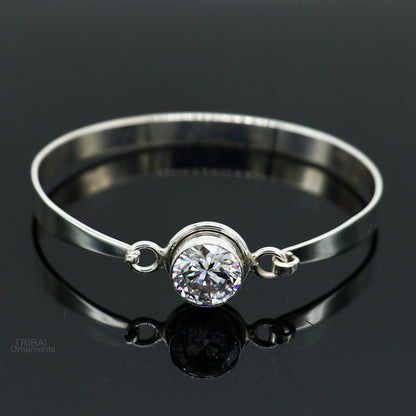 Elegant 925 sterling silver bangle bracelet with cubic zirconia stones, featuring intricate tribal-inspired design, perfect for gifting.