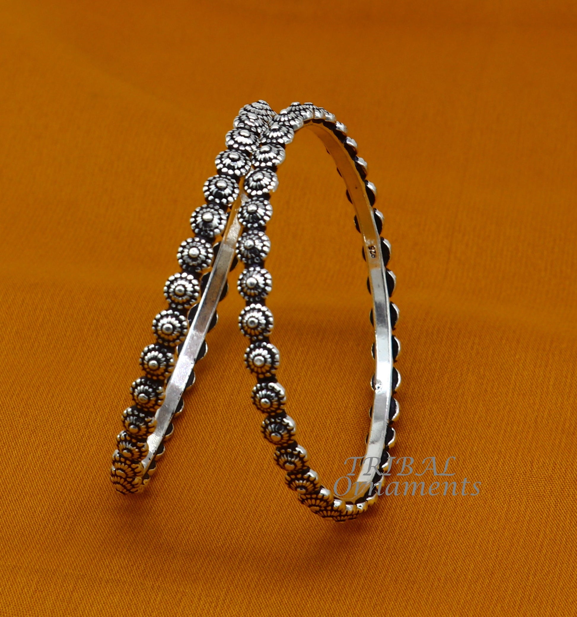 Elegant 925 sterling silver flower design bangle bracelet from TRIBAL ORNAMENTS, ideal for brides and wedding jewelry.