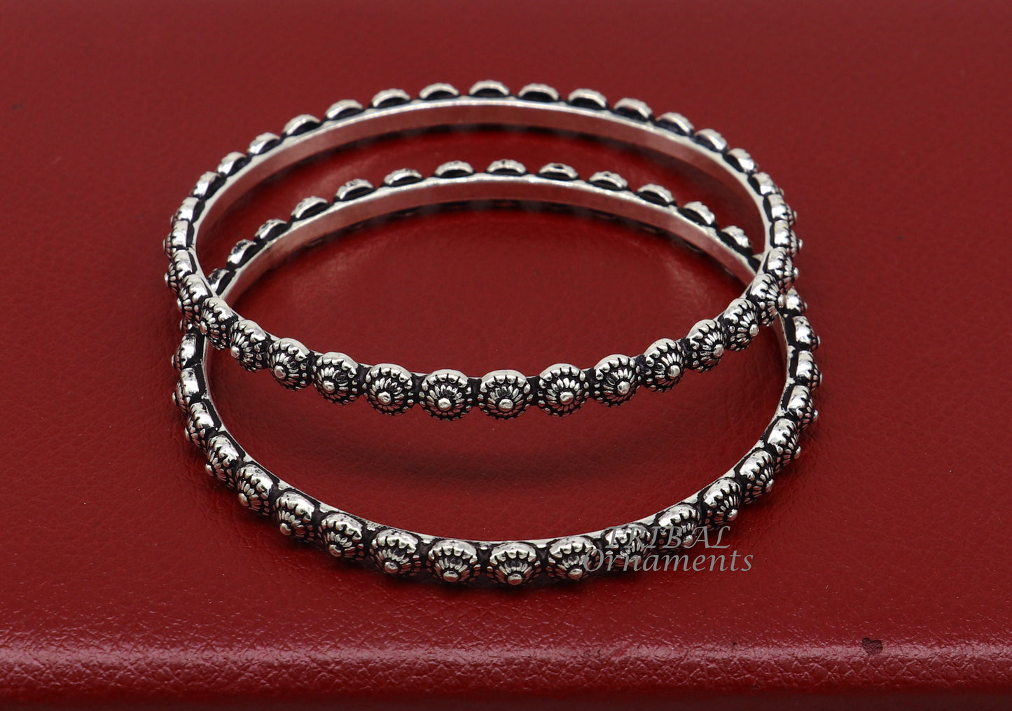 Sterling silver flower design bangle bracelet by Tribal Ornaments, intricate handmade wedding jewelry for brides from India.