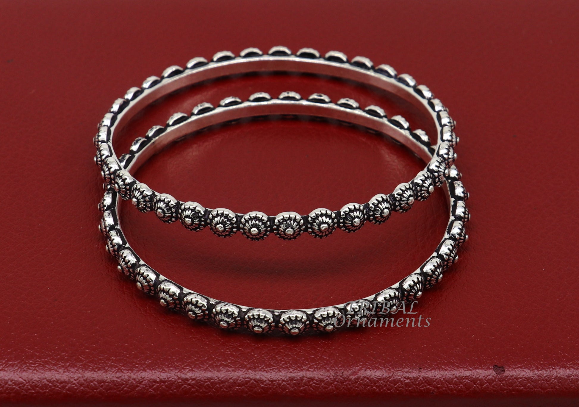 Sterling silver flower design bangle bracelet by Tribal Ornaments, intricate handmade wedding jewelry for brides from India.