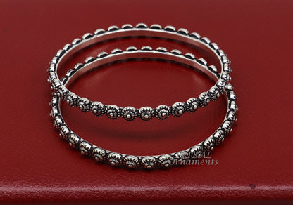 Sterling silver flower design bangle bracelet by Tribal Ornaments, intricate handmade wedding jewelry for brides from India.