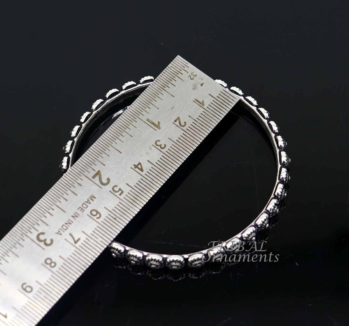 Elegant 925 sterling silver flower design bangle bracelet from Tribal Ornaments, perfect for brides and wedding jewelry.