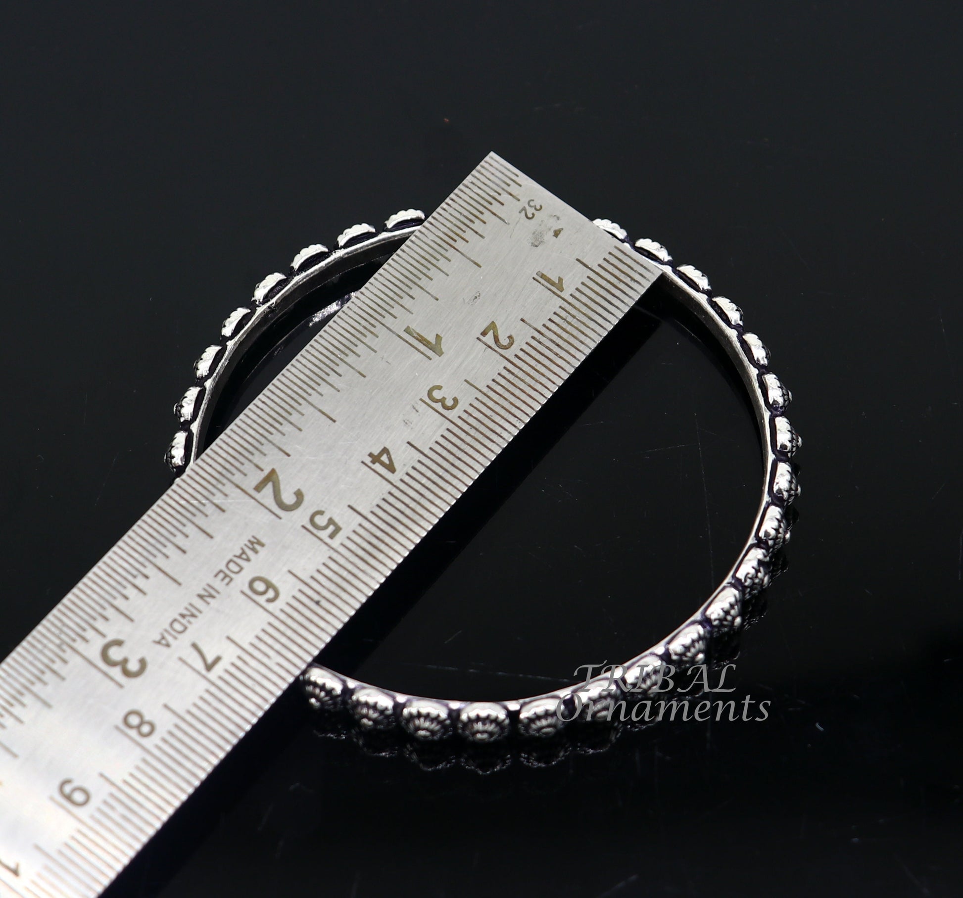 Elegant 925 sterling silver flower design bangle bracelet from Tribal Ornaments, perfect for brides and wedding jewelry.