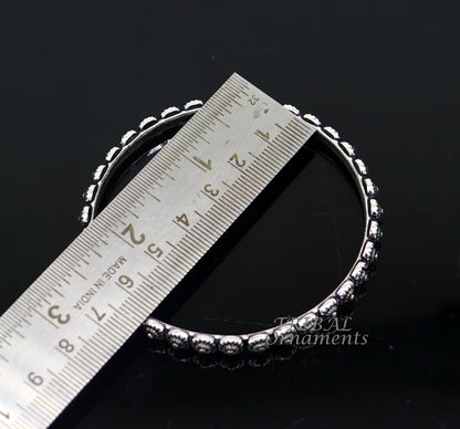 Elegant 925 sterling silver flower design bangle bracelet from Tribal Ornaments, perfect for brides and wedding jewelry.