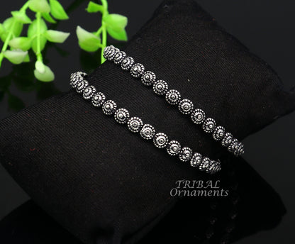 Elegant 925 sterling silver flower design bangle bracelet from TRIBAL ORNAMENTS, perfect for brides and wedding jewelry.