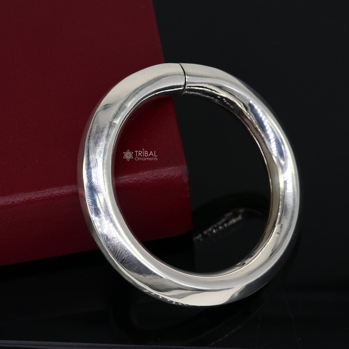 Sterling silver 12mm shine bright bangle bracelet by Tribal Ornaments, unisex handcrafted jewelry with a sleek, polished finish.