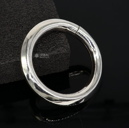 Sterling silver 12mm shine bright bangle bracelet by TRIBAL ORNAMENTS, unisex handmade jewelry with a smooth, polished finish.