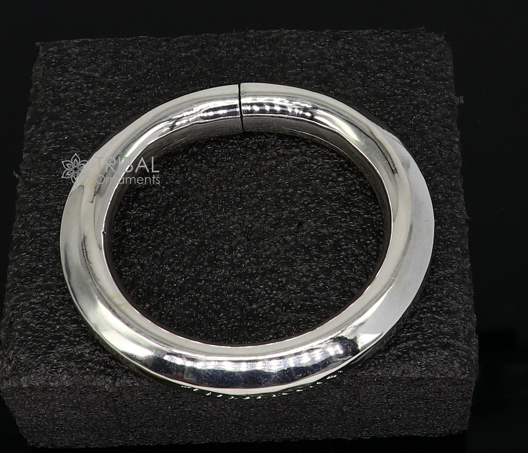 Sterling silver 12mm shine bright bangle bracelet by TRIBAL ORNAMENTS, handcrafted unisex jewelry with a smooth, polished finish.