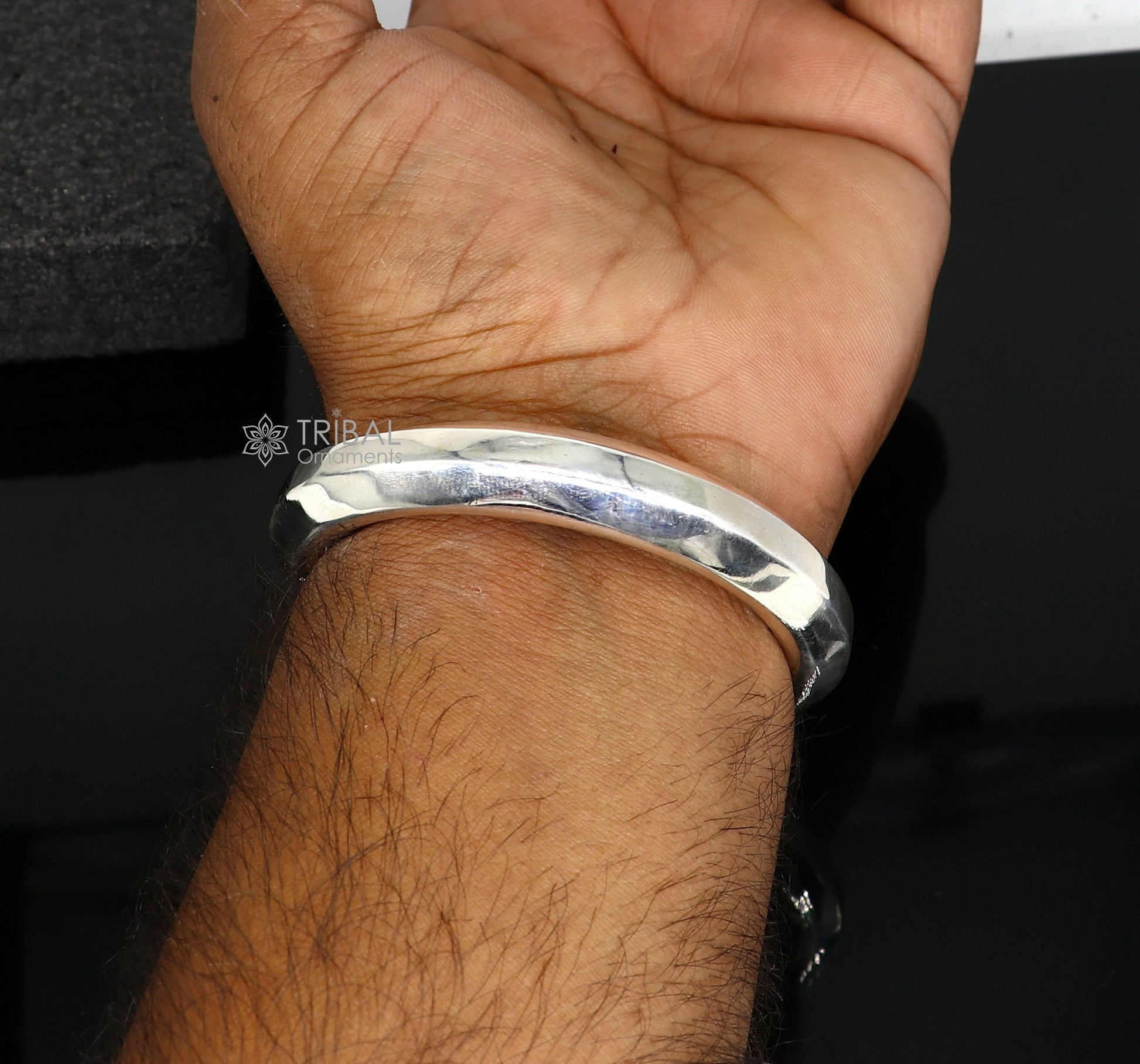 Sterling silver 12mm shine bright bangle bracelet by TRIBAL ORNAMENTS, showcasing a smooth, polished, unisex jewelry design.