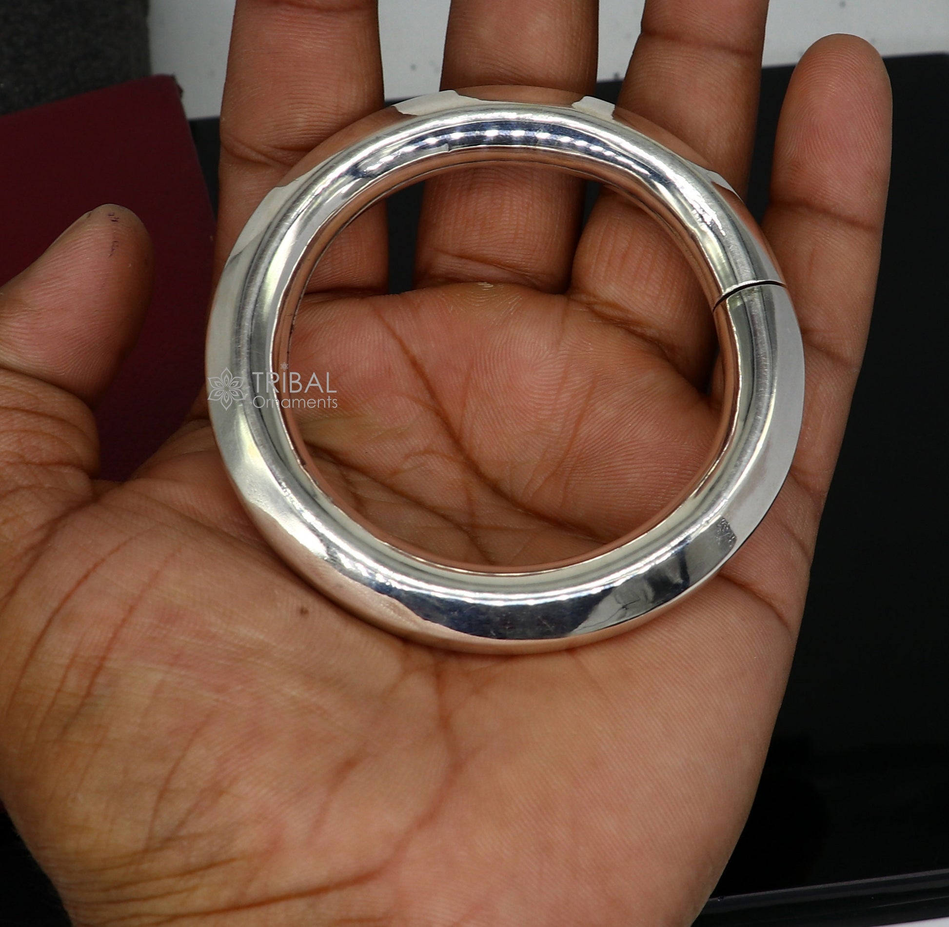 Sterling silver 12mm shine bright bangle bracelet by TRIBAL ORNAMENTS, featuring a smooth, personalized unisex jewelry design.