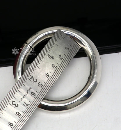 Sterling silver 12mm shine bright bangle bracelet by TRIBAL ORNAMENTS, handmade unisex jewelry with polished finish.