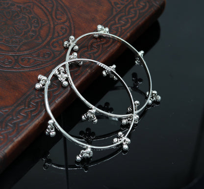 Sterling silver bridesmaid bangle bracelet with hanging bells, handcrafted by Tribal Ornaments, personalized wedding jewelry.
