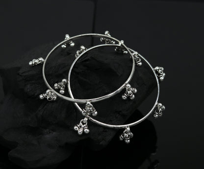 Sterling silver bridesmaid bangle bracelet with hanging bells, handmade and personalized by TRIBAL ORNAMENTS for special occasions.