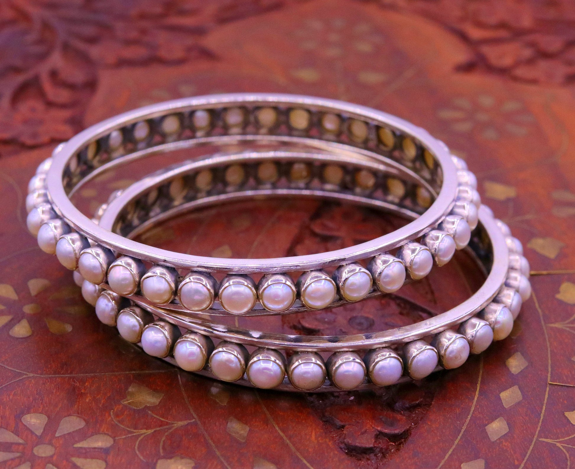925 sterling silver bangle with a lustrous pearl, handmade tribal jewelry, perfect for brides and cultural occasions.
