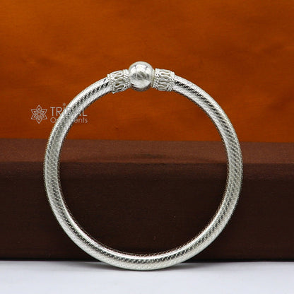 Sterling silver tribal bangle bracelet with a single shiny ball design, handmade ethnic jewelry by Tribal Ornaments.